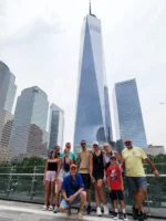 Tour group posing in front of Freedom Tower in NYC