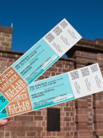 Statue of Liberty and Ellis Island admission tickets close up