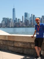 Tour Guide posing against New York Cityscape and Hudson river
