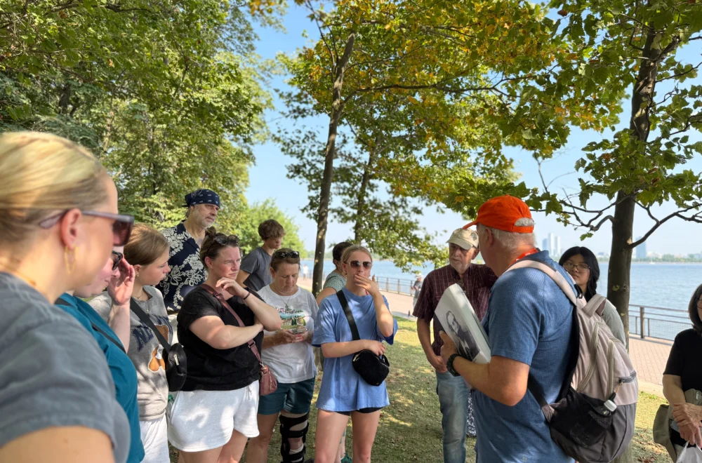 Tour group listening to the tour guide during Statue of Liberty and Ellis Island tour