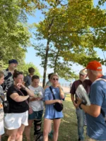 Tour group listening to the tour guide during Statue of Liberty and Ellis Island tour