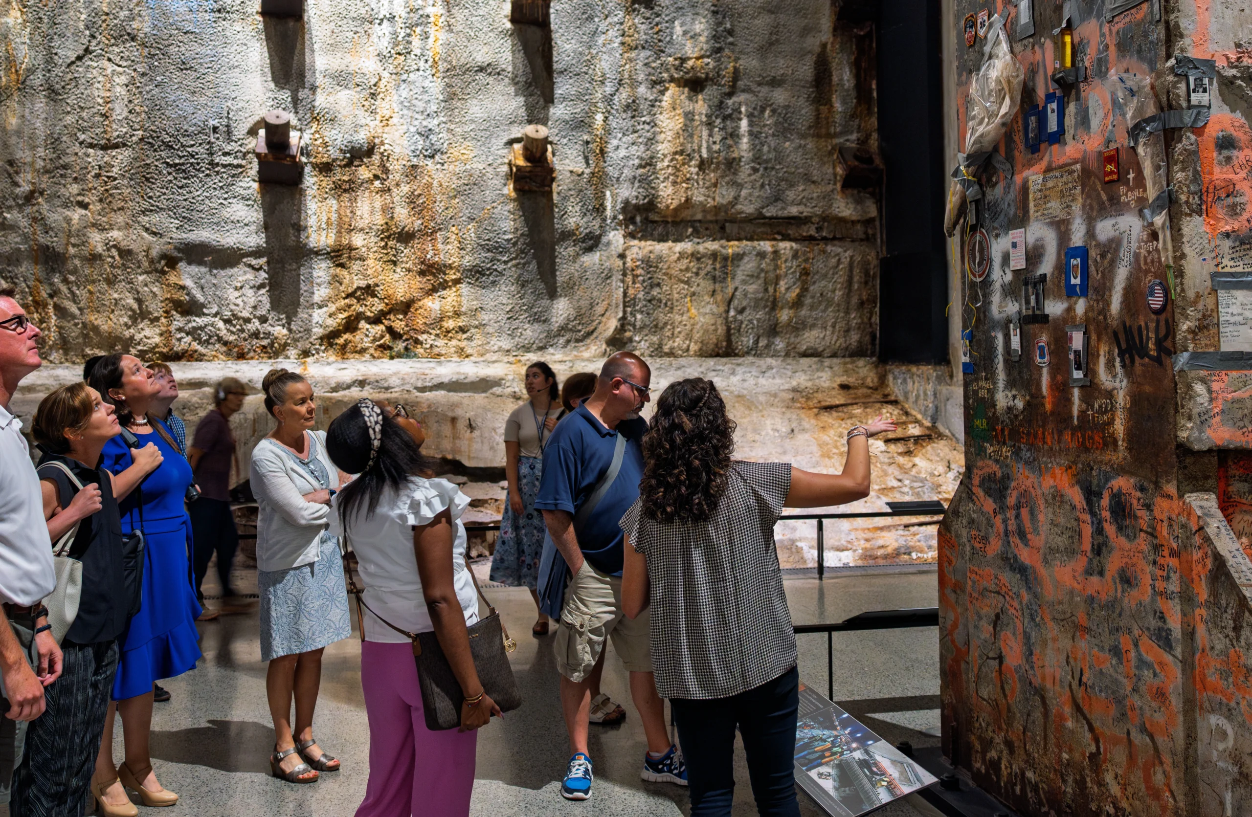 Tour group looking at museum exhibit during 9/11 Ground Zero VIP Insider Tour