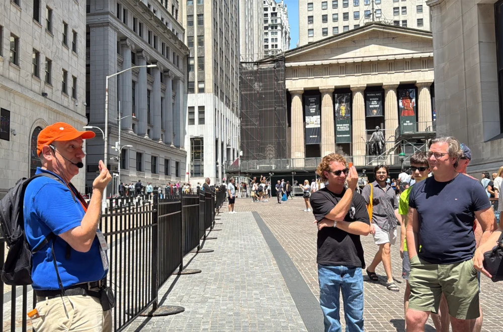 Tour guide and guests during the Wall Street Insider Tour in NYC
