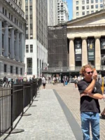 Tour guide and guests during the Wall Street Insider Tour in NYC