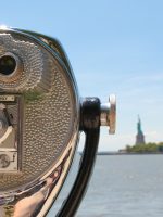 Tower viewer with Statue of Liberty in the background during Statue of Liberty and Ellis Island tour