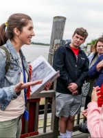 local tour guide with a group of tourists on a Statue of Liberty tour