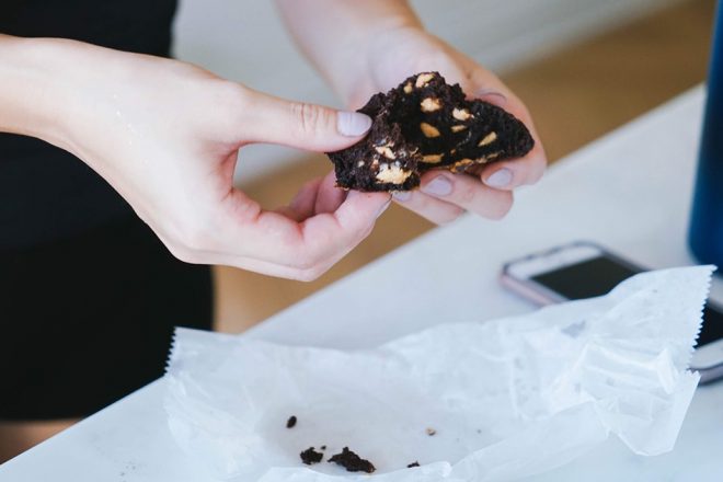 Breaking-a-crumbling-cookie-for-an-NYC-cookie-crawl