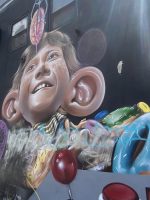 Bushwick graffiti art with mural of boy