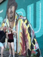 People taking image with mural in Bushwick during Brooklyn Bronx and Queens tour