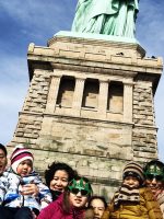 Family at Statue of Liberty on guided tour