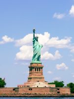 Tourists looking at Statue of Liberty from ferry