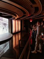 Visitors taking photos at the Welcome Gallery in Rockefeller Center