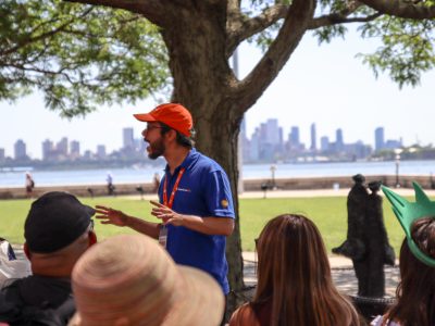 Tour Guide talking to group during Statue of Liberty and Ellis Island tour