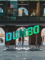 People walking near Dumbo sign in Brooklyn NYC