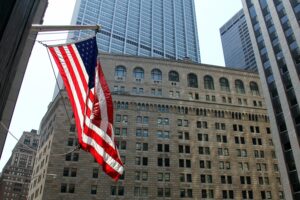 American Flag in front of Federal Reserve Building in Wall Street NYC
