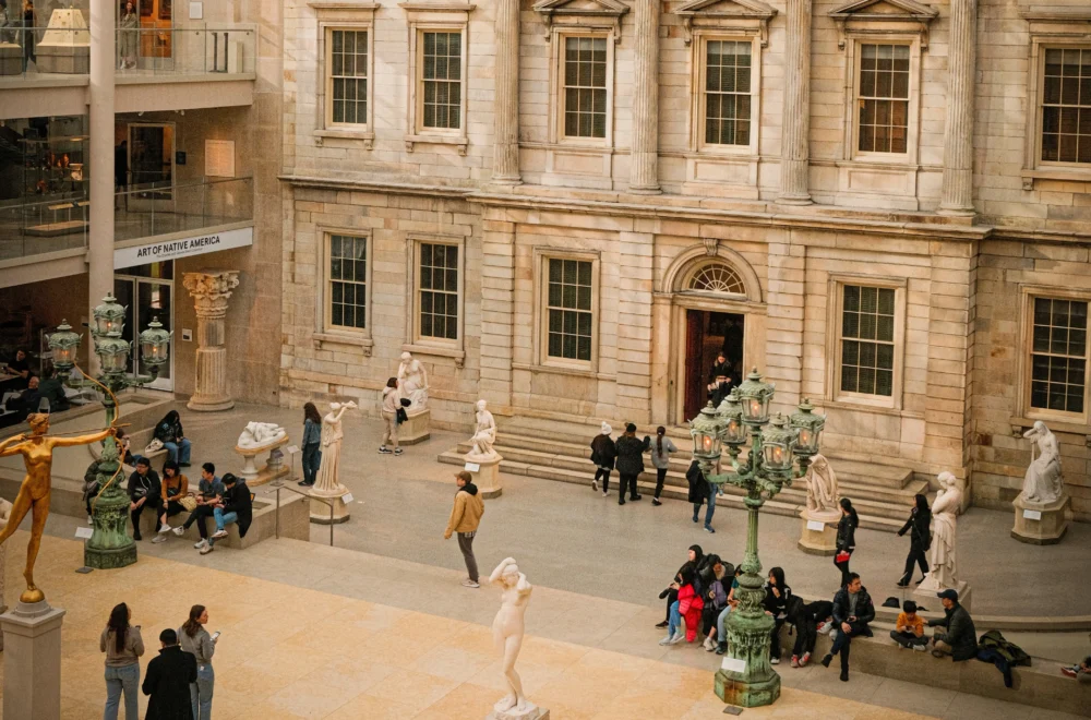 Group of people in the Met museum during the daytime