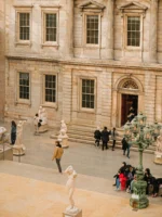 Group of people in the Met museum during the daytime