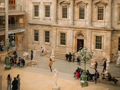 Group of people in the Met museum during the daytime