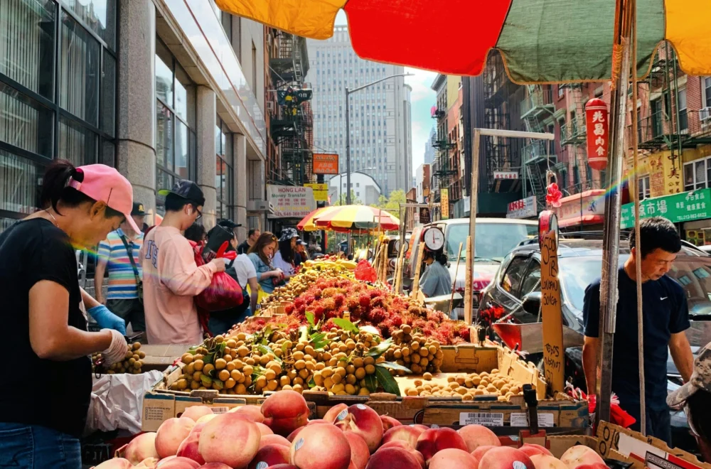 People in Chinatown market during daytime during private Beyond Manhattan guided tour