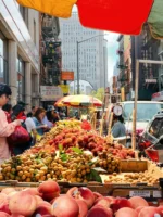 People in Chinatown market during daytime during private Beyond Manhattan guided tour