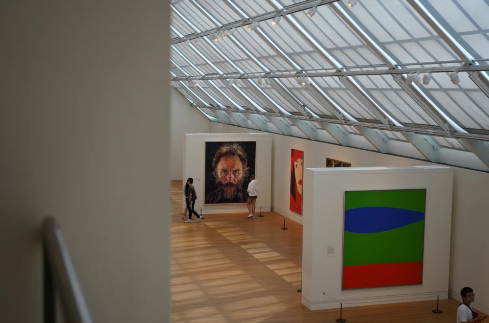 Two people standing and looking at painting during The Met and Central Park private guided tour