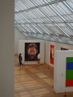 Two people standing and looking at painting during The Met and Central Park private guided tour