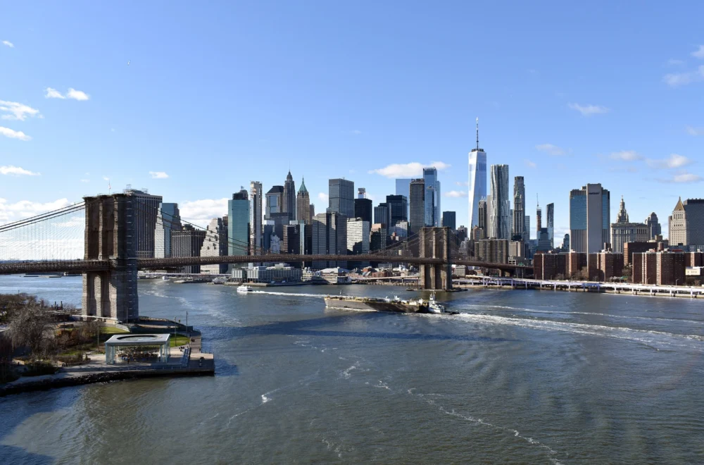 View of NYC skyline and Brooklyn Bridge on a sunny day