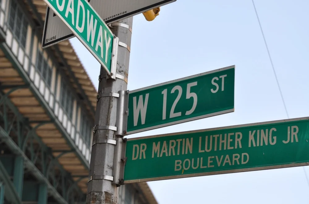 View of street signs in Harlem, New York City