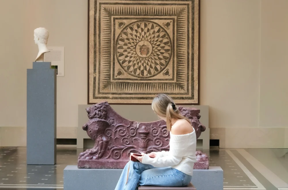 Woman sitting on bench in The Met during private NYC guided tour