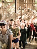 tour group climbing eiffel tower