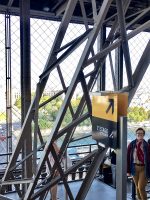 group climbing eiffel tower