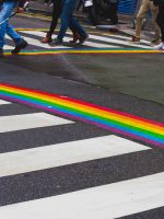 Pedestrian crosswalk with painted rainbow from both sides in Le Marais quarter in Paris