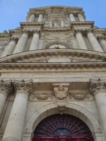 Ornate stone doorway of a historic Parisian church visited on the Le Marais tour.