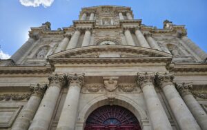 Ornate stone doorway of a historic Parisian church visited on the Le Marais tour.