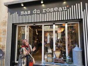 Tour guide introducing Mas du Roseau, a charming boutique in the heart of Le Marais.