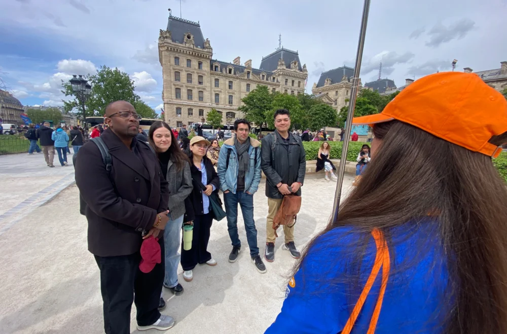 Guests listening to Notre-Dame tour guide in Paris