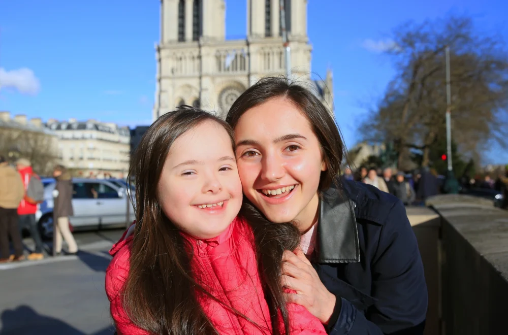Mother and daughter posing in front of Notre-Dame cathedral in Paris (1)