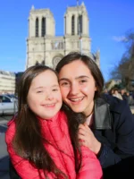 Mother and daughter posing in front of Notre-Dame cathedral in Paris (1)