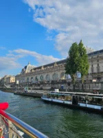 Travelers looking at the view during Seine River cruise