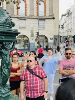 Guide and guests at Fontaine Wallace in Unofficial Emily in Paris tour