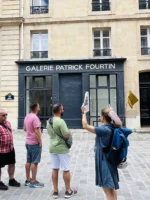 Guide explaining to the group during Unofficial Emily in Paris tour at Place de Valois