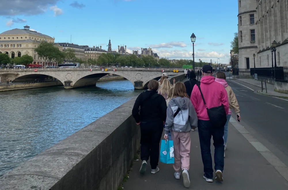 Guests on Paris Ghost Tour walking by the Seine