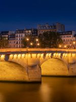 Pont Neuf Bridge Near Apartment Buildings Under Night Sky in Paris Ghost Tour