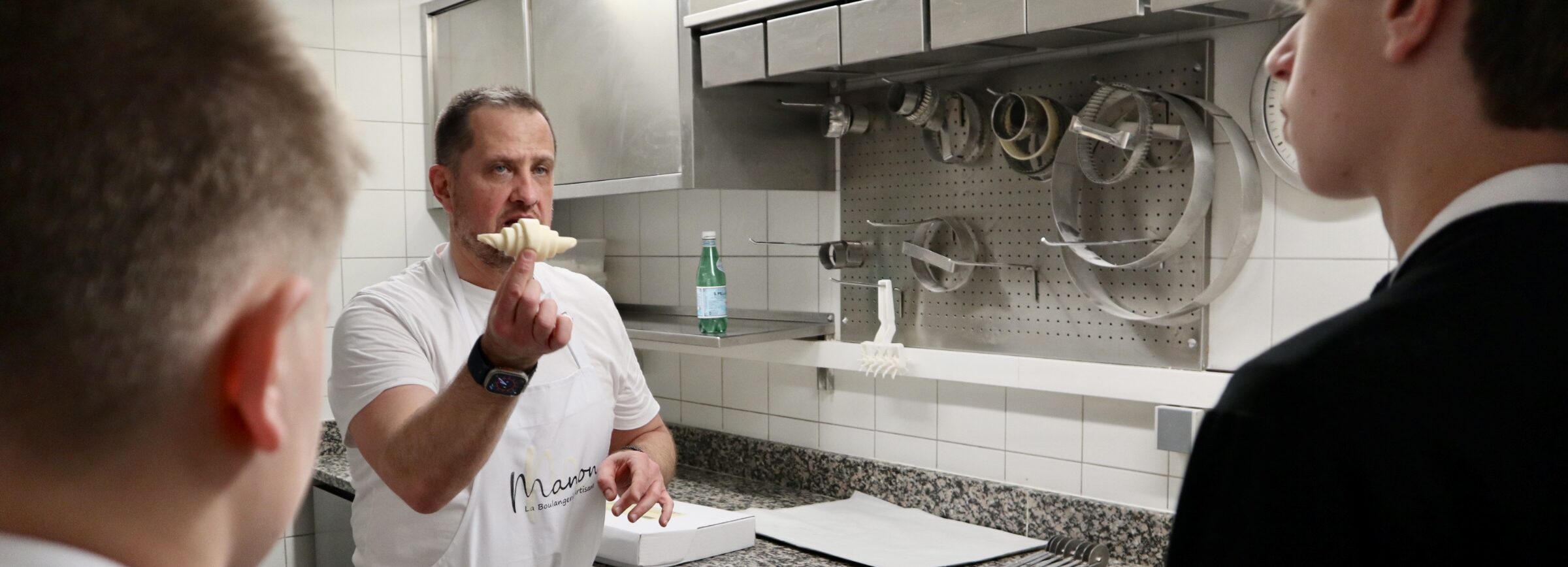 Igor presenting rolled croissant dough during French Baking Experience