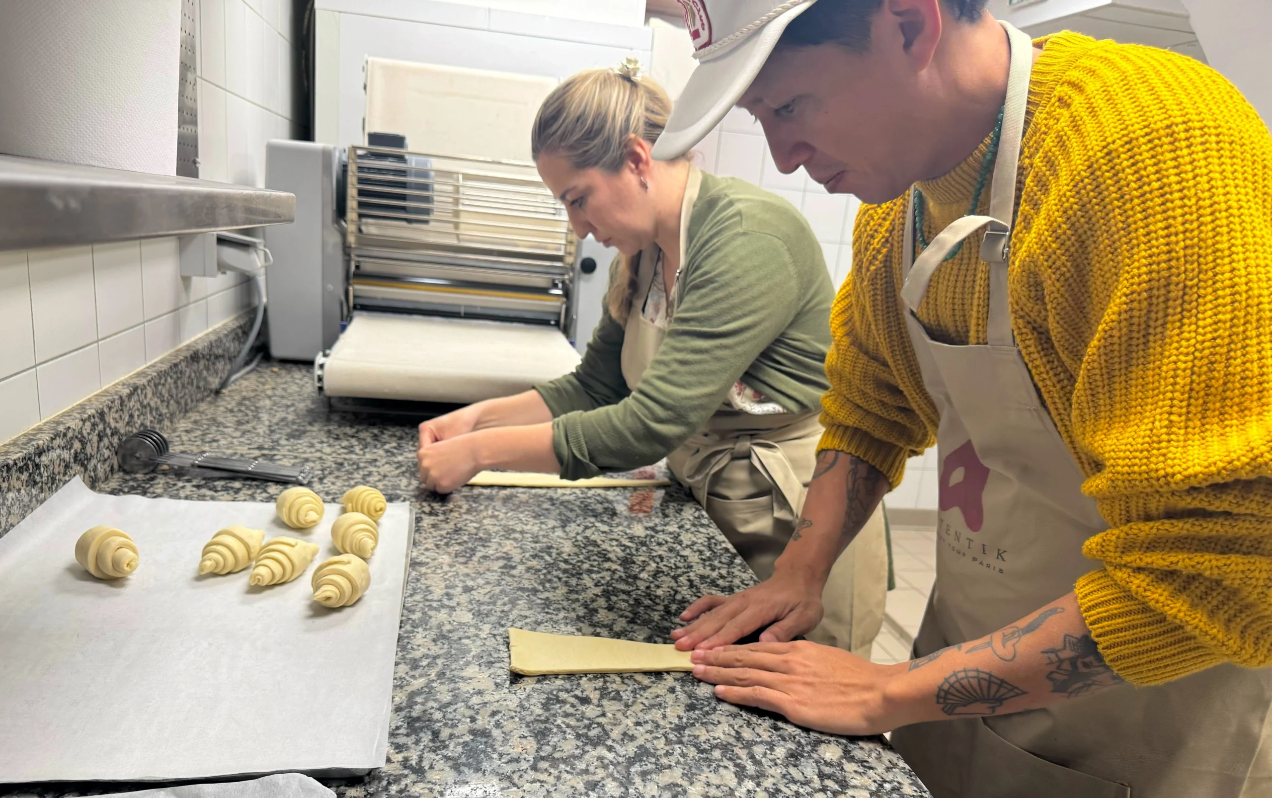 Rolling croissants in bakery class