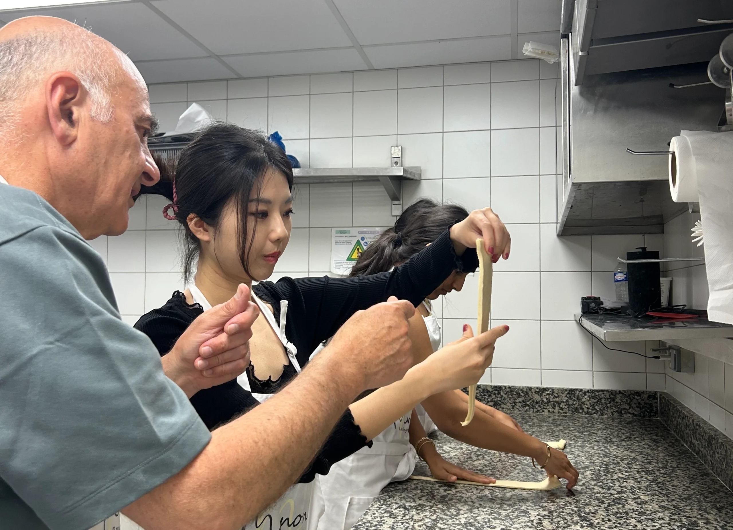 Working with bread during French baking experience in Paris