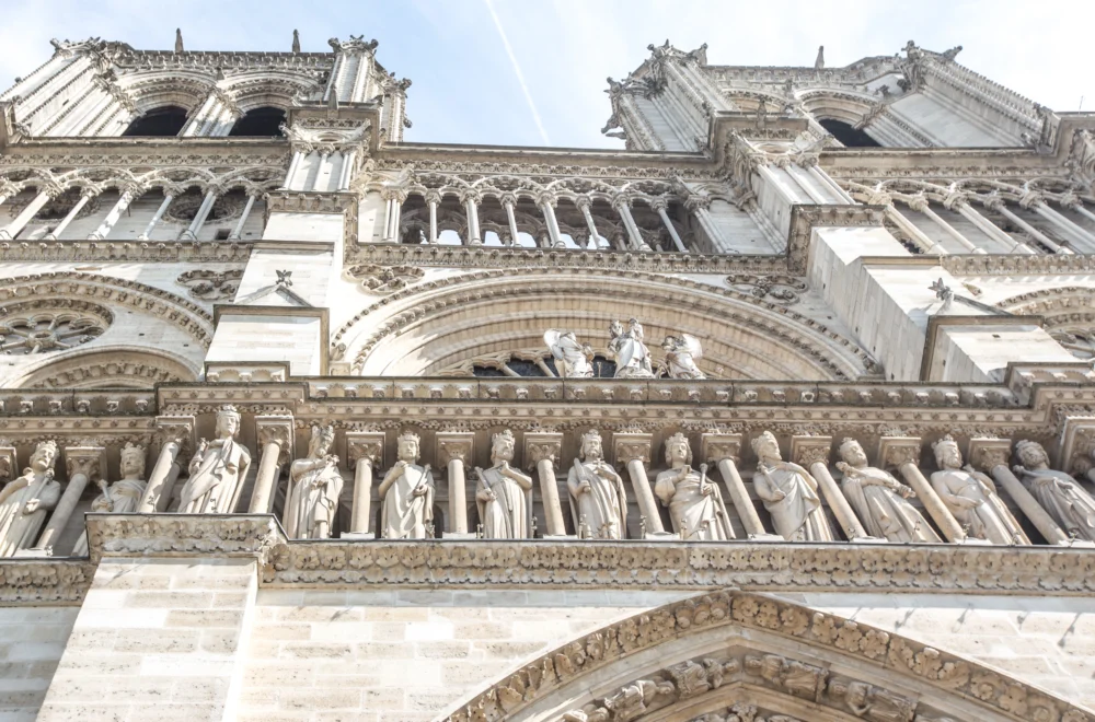 Closeup of sculptures on cathedral during Notre-Dame walking tour_