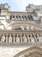 Closeup of sculptures on cathedral during Notre-Dame walking tour_