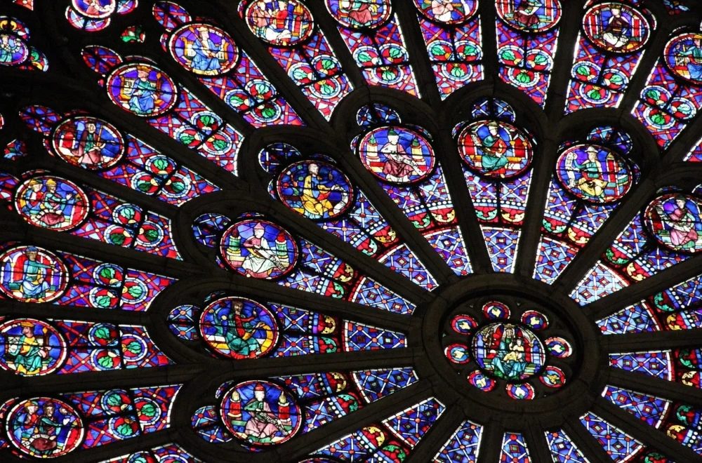 Detail of stained glass window in Notre Dame cathedral in Paris