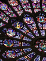 Detail of stained glass window in Notre Dame cathedral in Paris